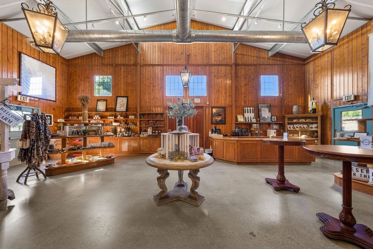 The wood-panelled tasting room and gift shop, with a central fountain and tasting bar